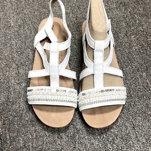 Size 7 women’s sandal with a slight heel. Never worn